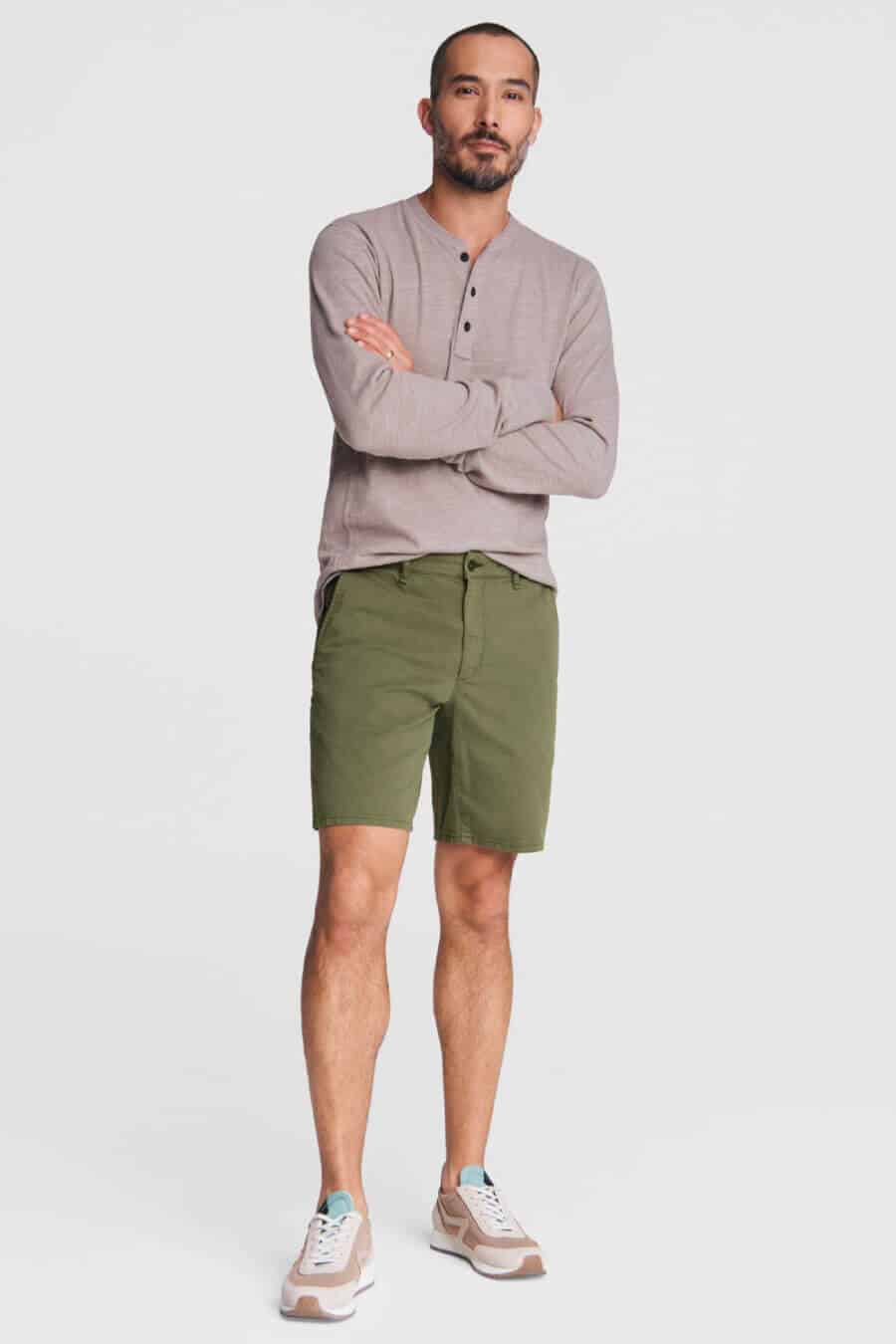 Men's shorts, henley top and canvas sneakers outfit