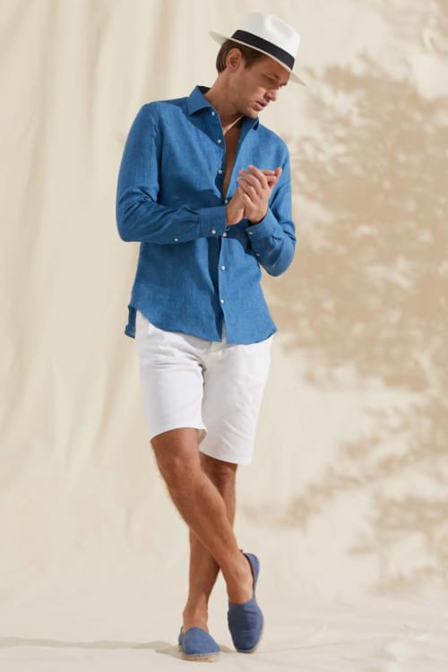 Men's smart casual summer outfit with shorts, linen shirt, espadrilles and panama hat