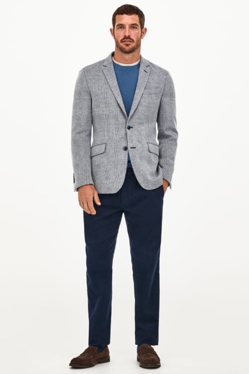 Men's navy trousers and light blue blazer with loafers outfit