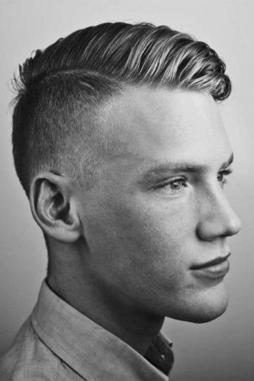 Men's loose side parting hairstyle with high fade