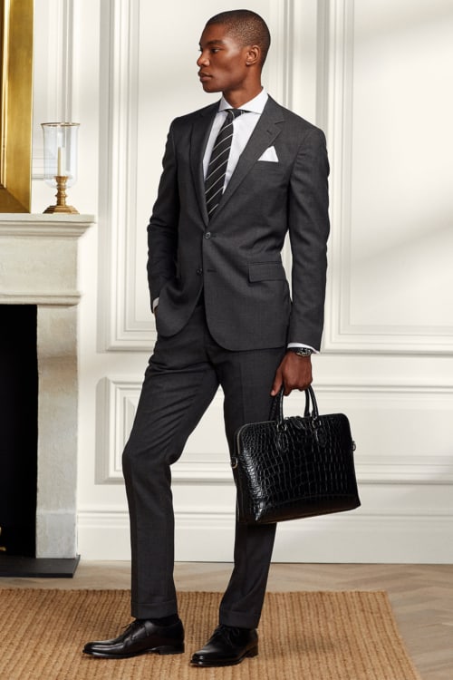 Men's black suit, white shirt, black tie smart outfit