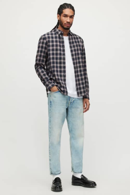 Men's 90s grunge jeans, t-shirt and flannel check shirt outfit