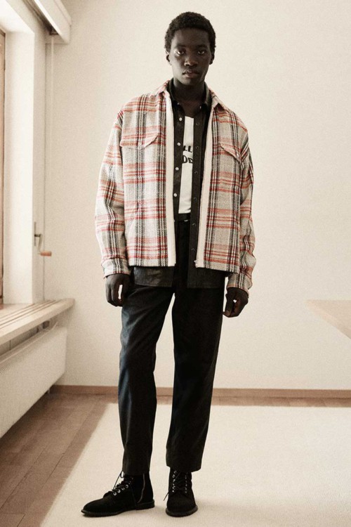 Men's black pants, printed white T-shirt, black shirt, red/grey check overshirt and black suede boots outfit