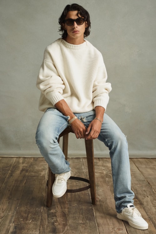 Men's 90s pale jeans and oversized white knitwear outfit