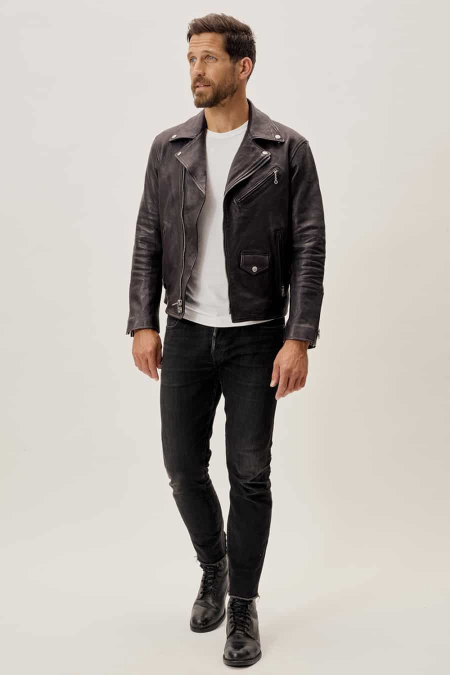 Men's black jeans, black boots, white T-shirt and black leather jacket outfit