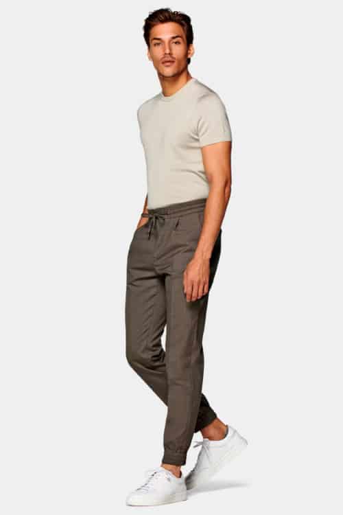 Men's drawstring trousers and tucked in T-shirt outfit