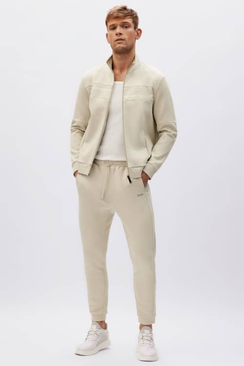 Men's beige sweatpants, white T-shirt and track jacket outfit