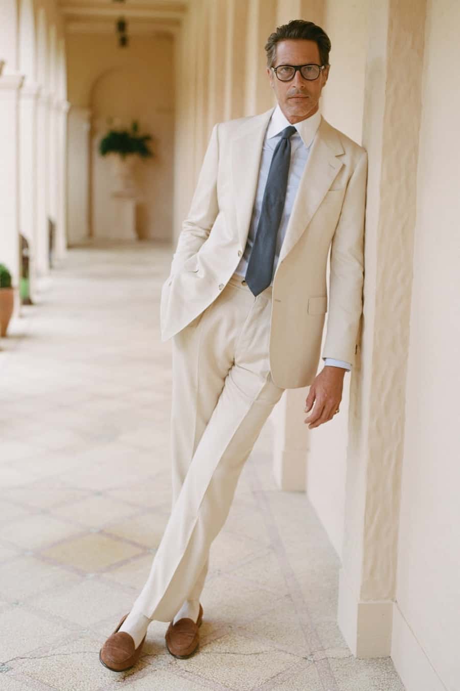 A man in a white made-to-measure suit
