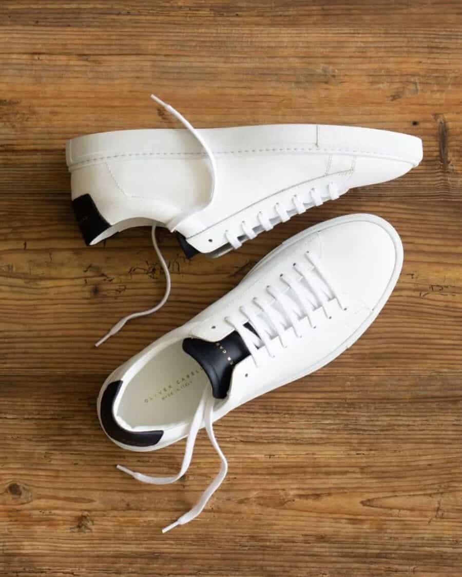 Men's white minimalist Oliver Cabell sneakers with black heel and tongue detailing