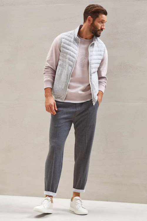 Men's athleisure sweatpants, sweatshirt and quilted gilet outfit