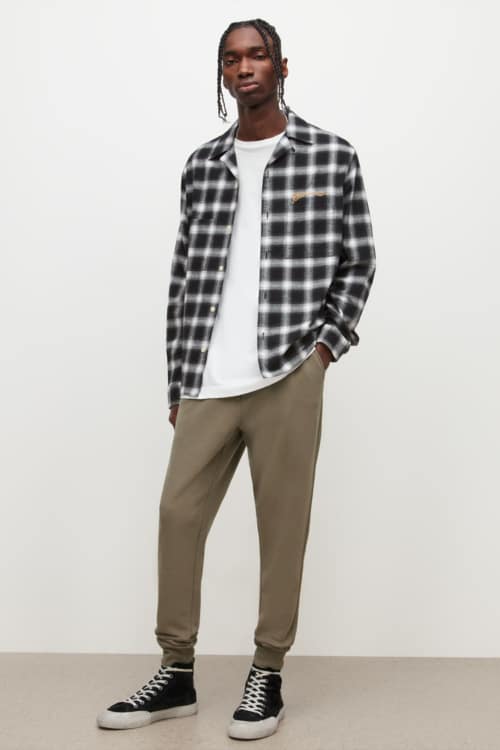 Men's grunge checked shirt, white t-shirt and khaki jogging pants outfit