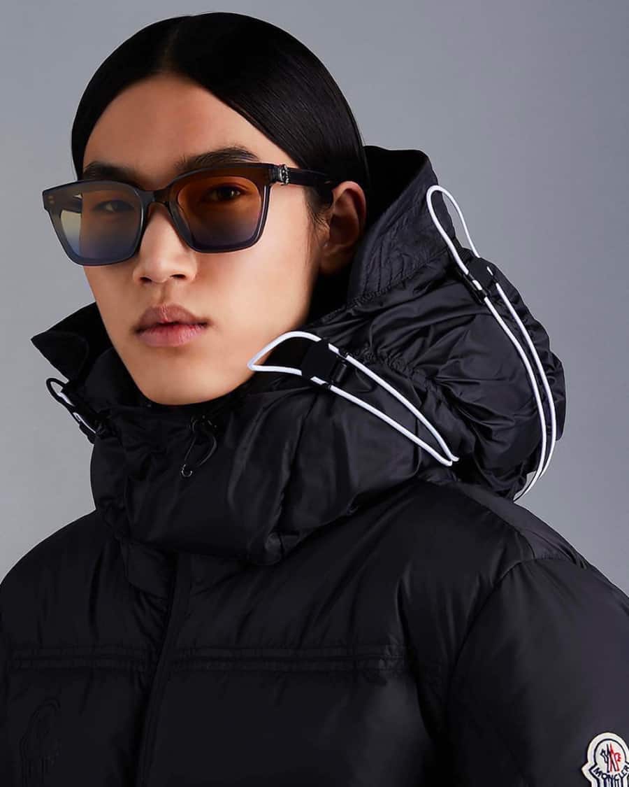 Gentlemonster men's luxury sunglasses worn with a black winter coat