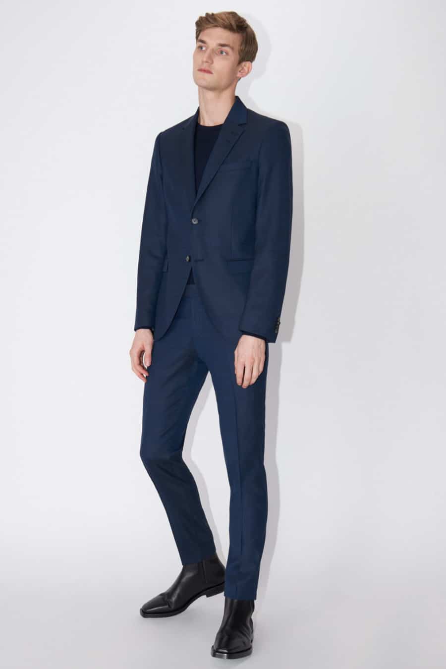 Men's navy suit, black T-shirt and black leather Chelsea boots outfit