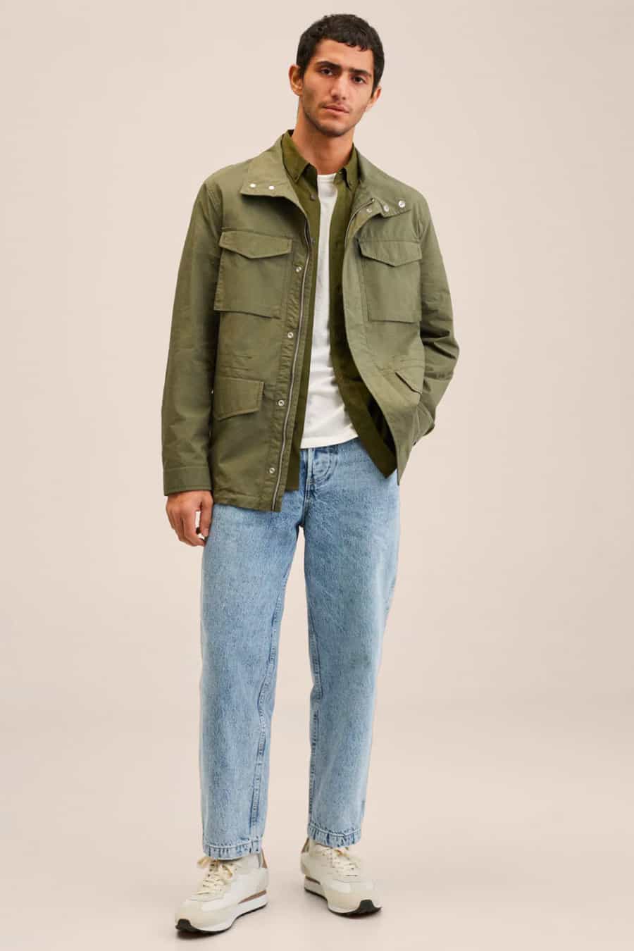 Men's light blue wash jeans, white T-shirt and green field jacket outfit
