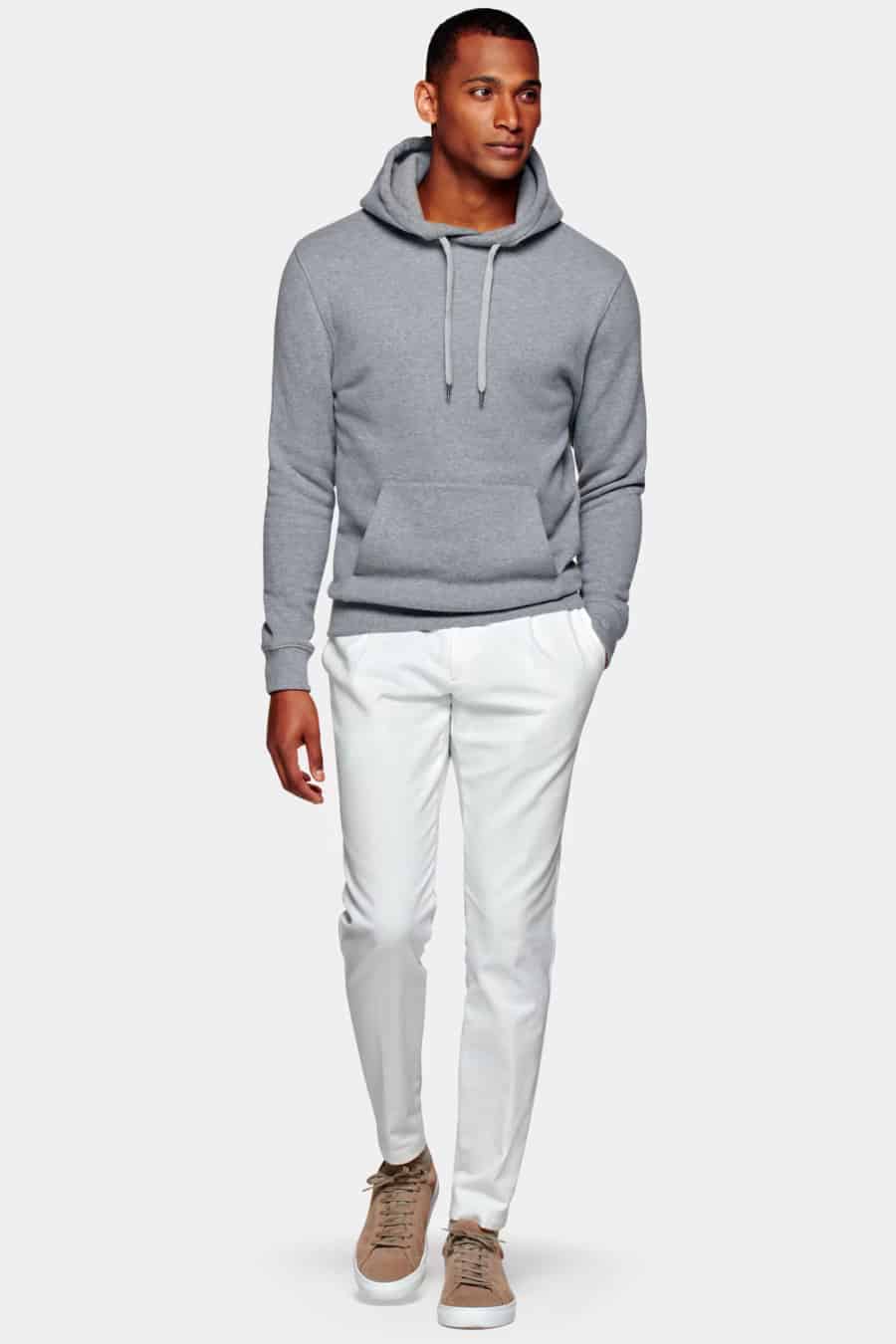 Men's white pants, luxe hoodie and suede sneakers outfit