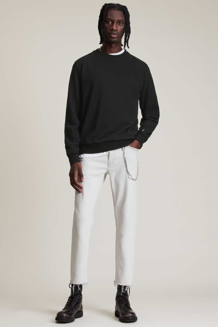 Men's white pants, black sweatshirt and black leather boots outfit