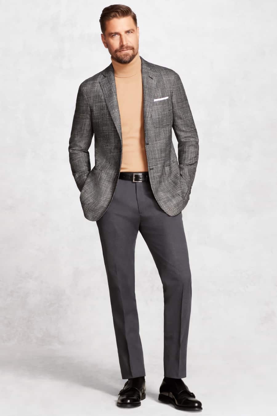 Men's charcoal trousers, camel turtleneck, light grey check blazer and black leather monk-strap shoes separates outfit