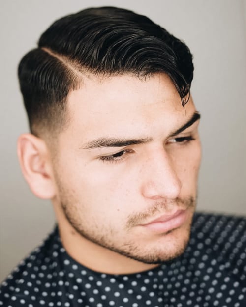 Men's hard parting with low taper fade haircut