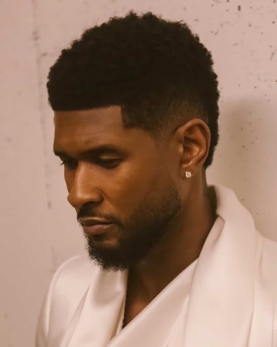 Usher short afro with low taper fade haircut
