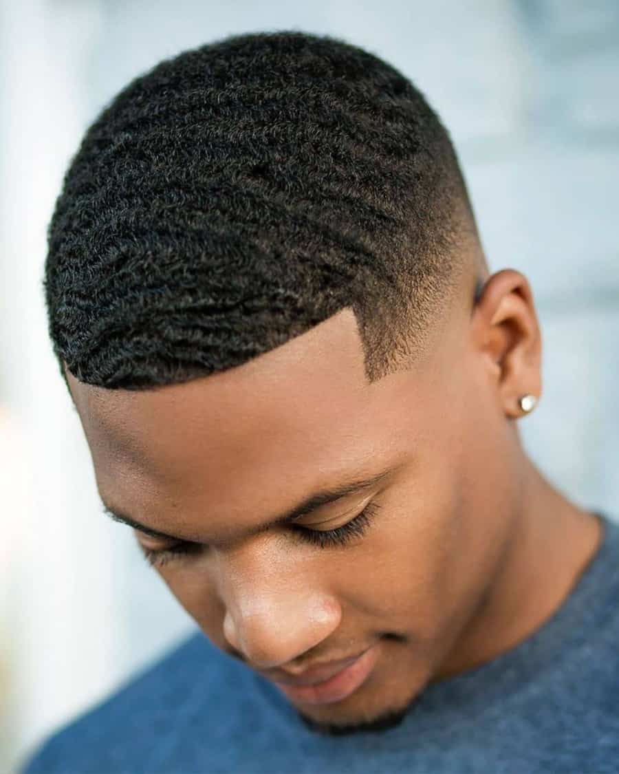 Black men's waves haircut with low taper fade
