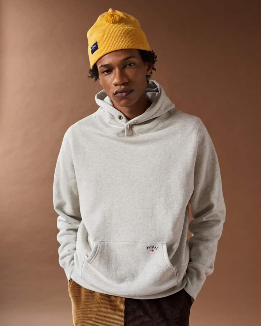 Noah streetwear hoodie worn with cords and yellow beanie