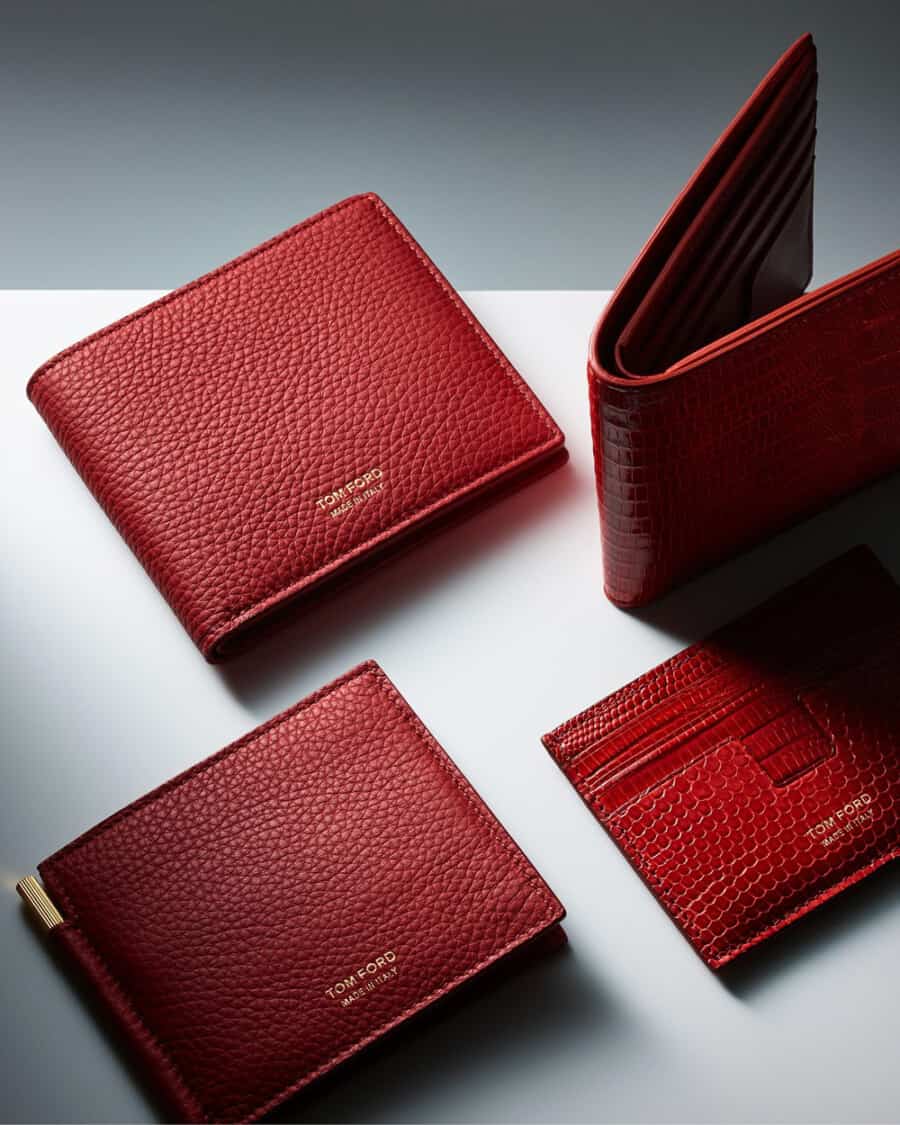 A selection of luxury red grain leather Tom Ford wallets for men