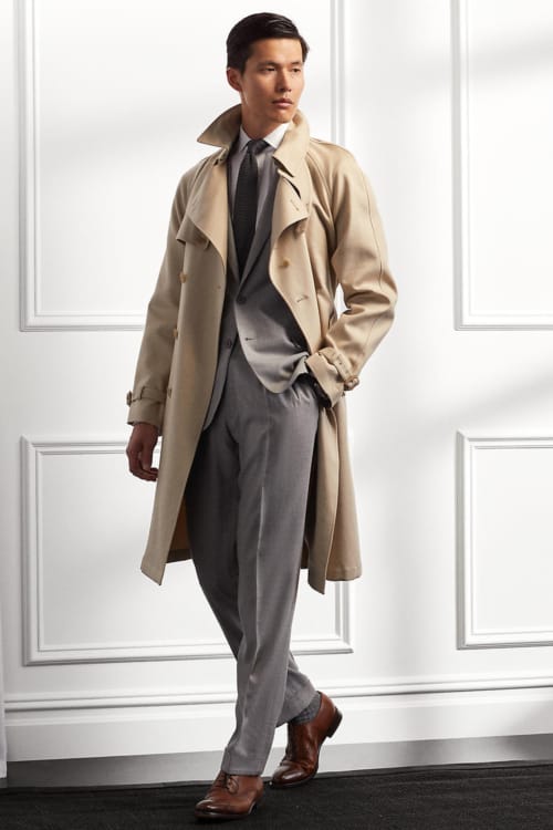 Men's grey business suit, brown Oxford shoes and beige trench coat outfit