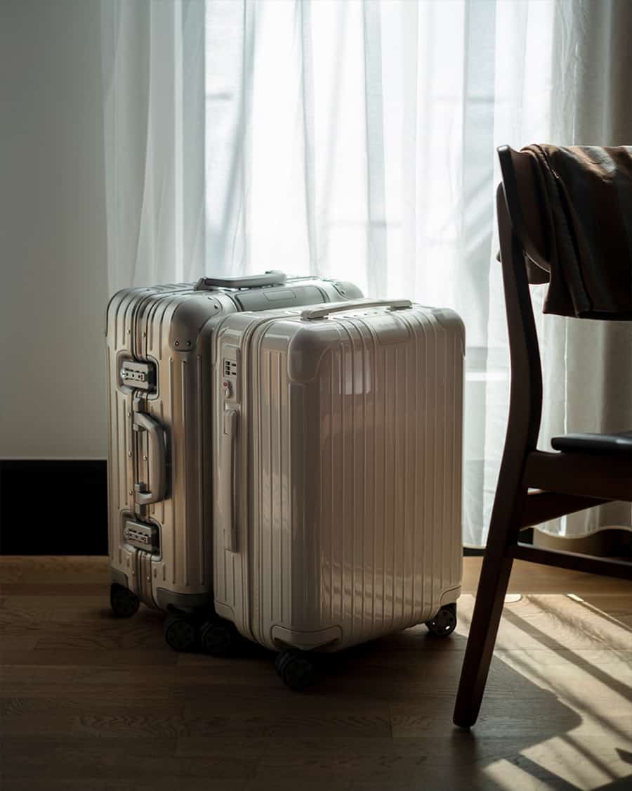 Two Rimowa luxury aluminium wheeled suitcases