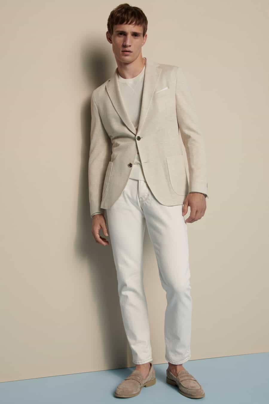 Men's. white jeans, white T-shirt, off-white blazer and suede loafers outfit