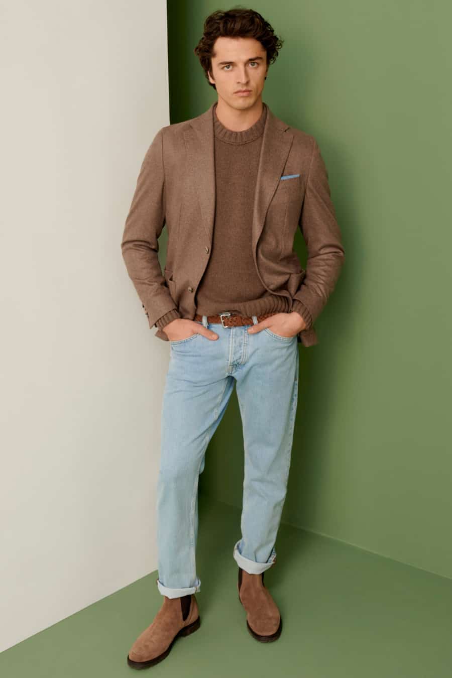 Men's light wash jeans with brown knitted sweater, brown blazer and suede Chelsea boots outfit