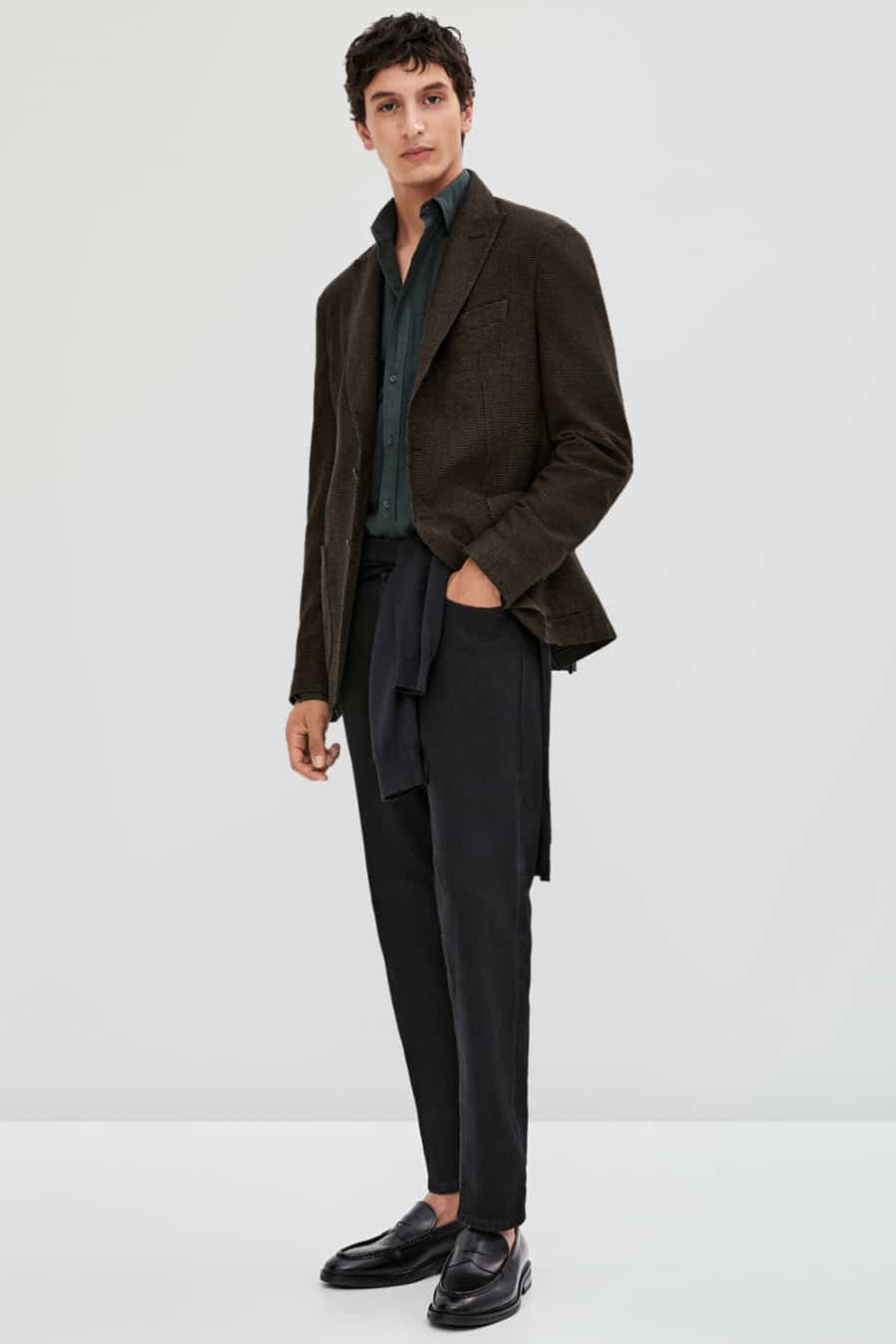 Men's black jeans, green shirt, brown blazer and loafers outfit