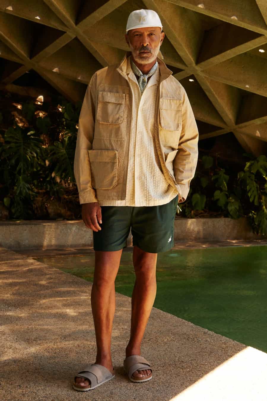 Men's green shorts, sandals, Cuban collar shirt, field jacket and baseball cap preppy outfit