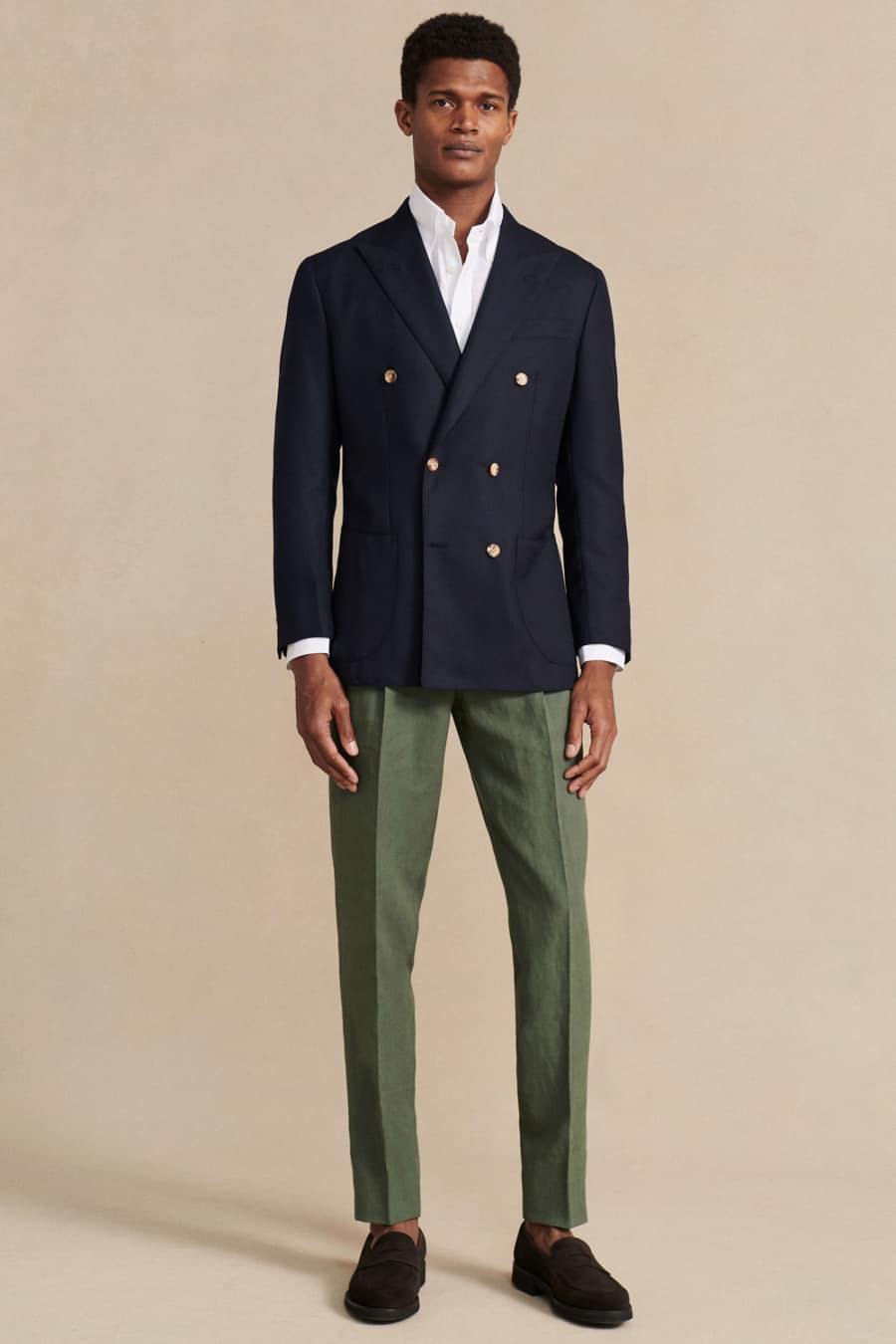 Men's green trousers, white shirt, navy boating blazer and brown suede loafers Ivy League outfit