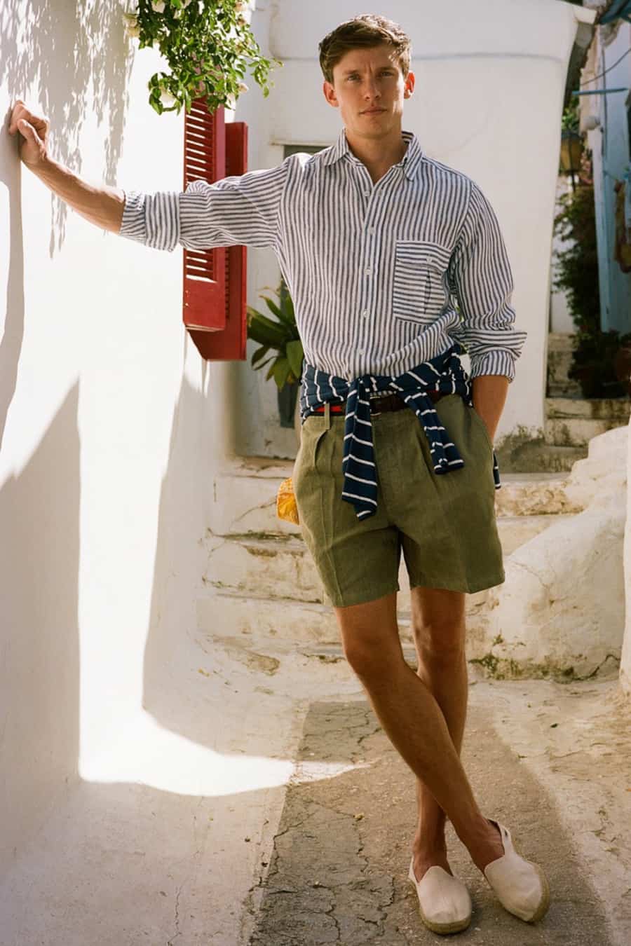 Men's green pleated shorts, vertical striped shirt, breton top and espadrilles summer outfit