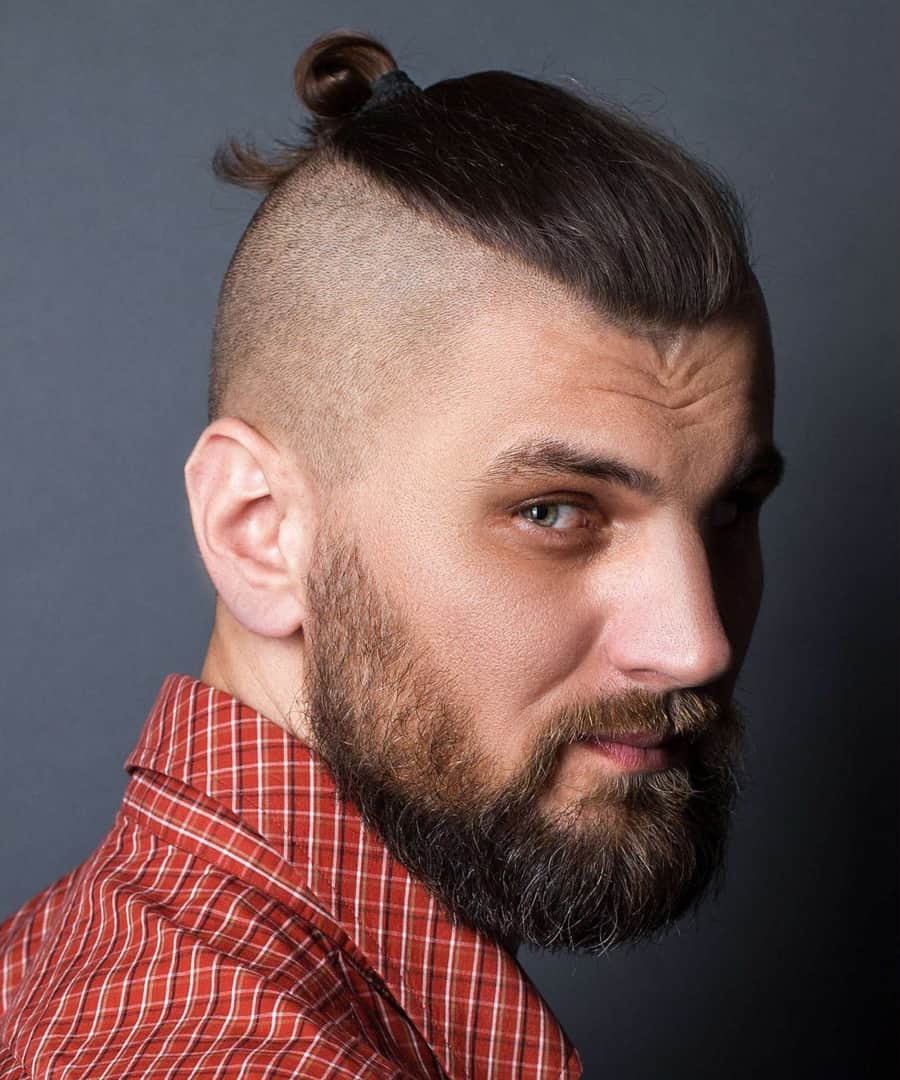 Men's top knot shaved sides haircut