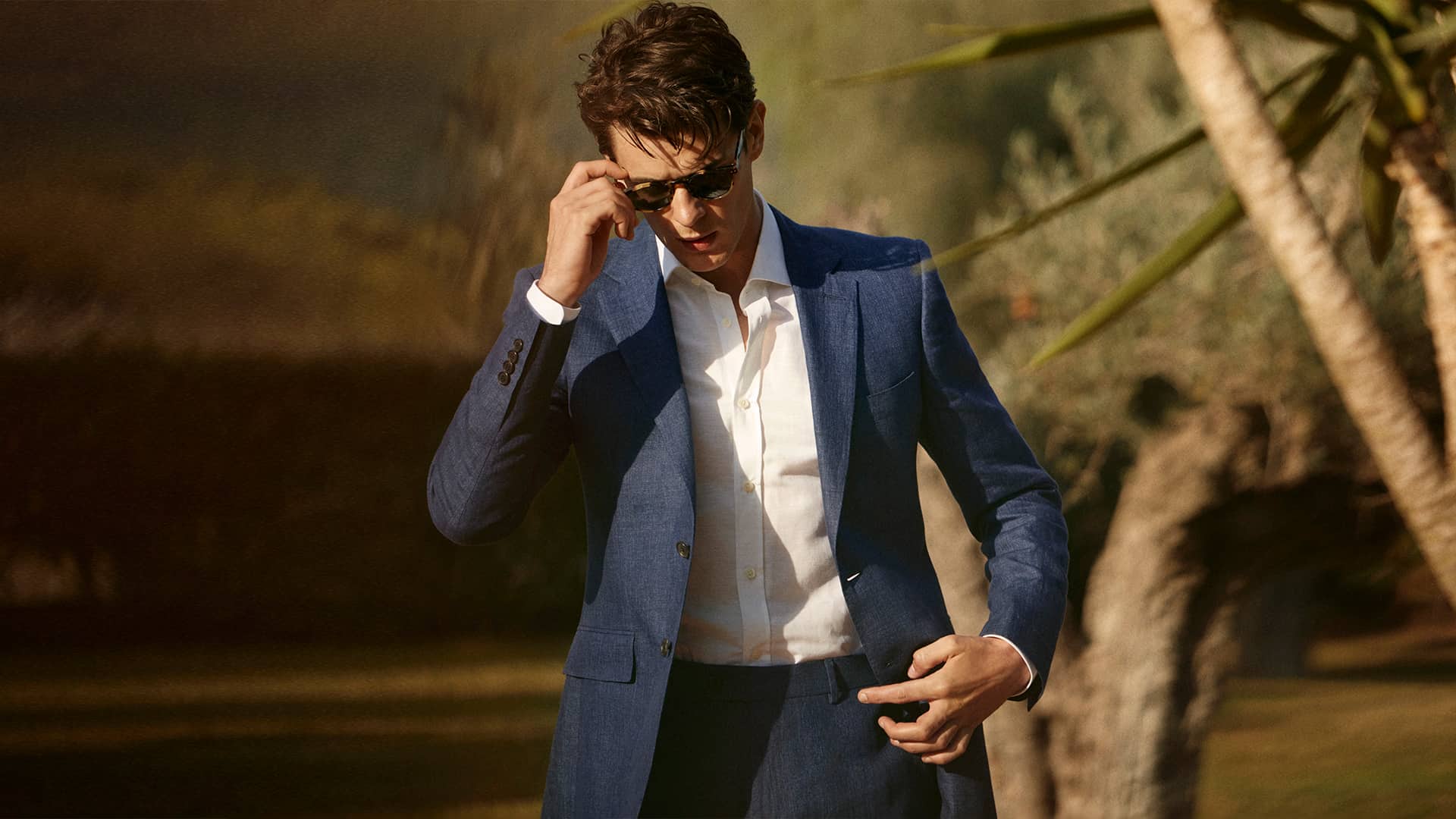 Men's semi formal summer attire: light blue textured suit with white shirt
