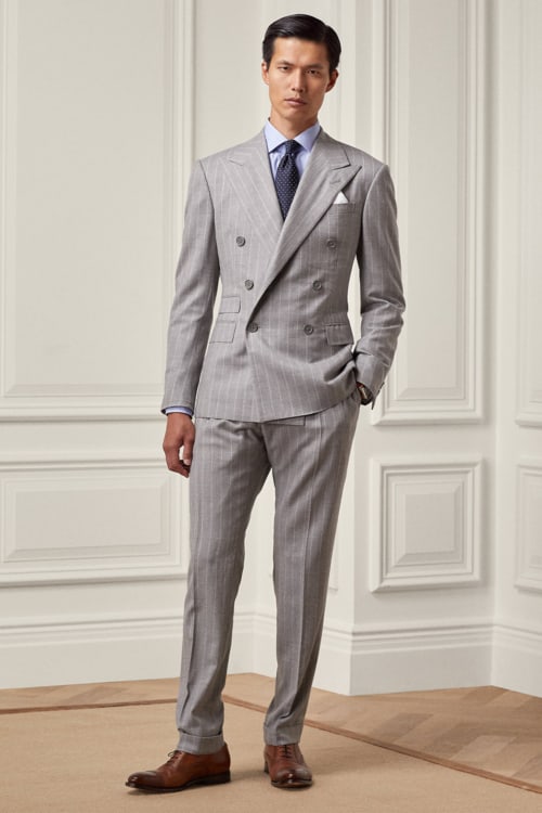 Men's light grey chalk stripe double-breasted suit worn with a shirt and tie