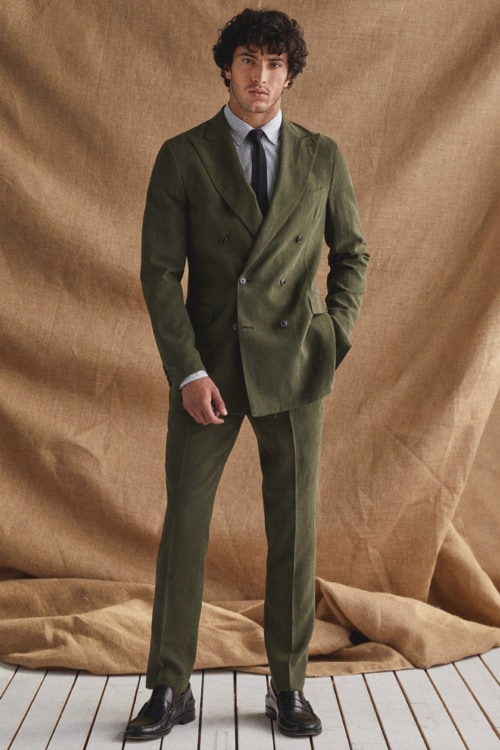 Men's green double breasted suit worn with a shirt and tie