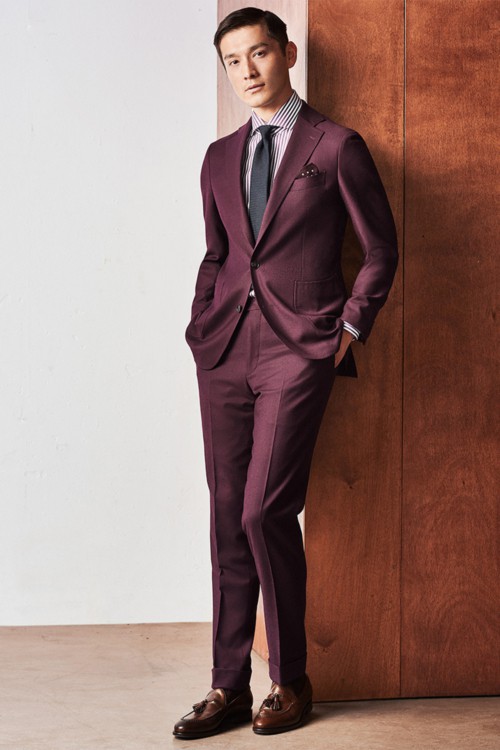 Men's burgundy suit worn with a shirt and tie