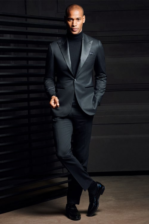 Men's black suit worn with black turtleneck
