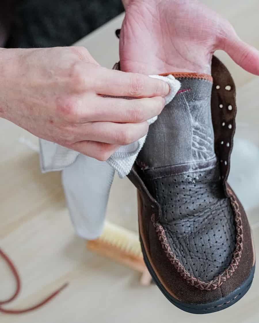 Using a specialist suede shampoo to clean suede boots