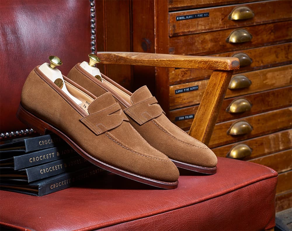 Men's suede loafers with shoe trees in them