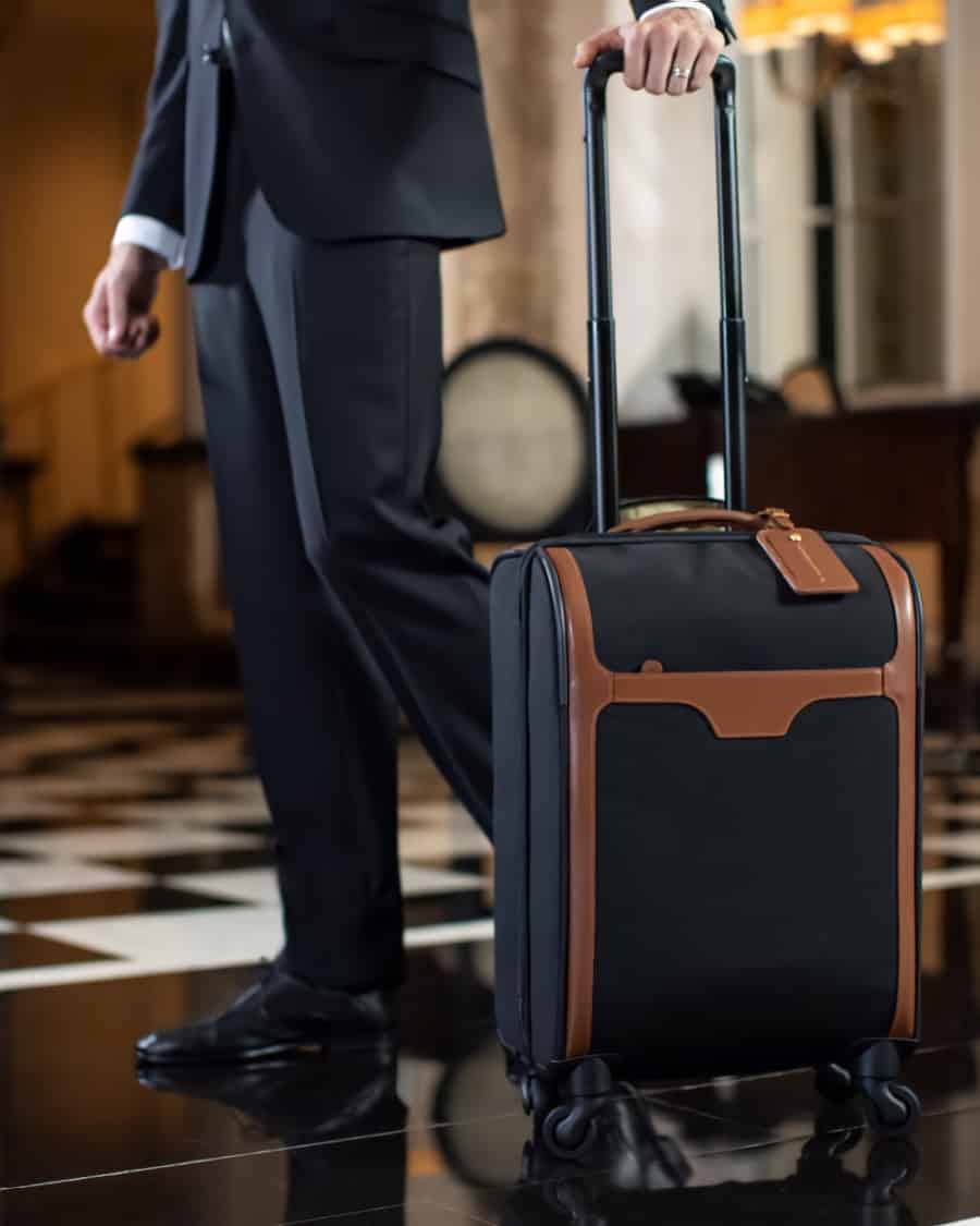 Bell boy with luxury T.Anthony wheeled suitcase