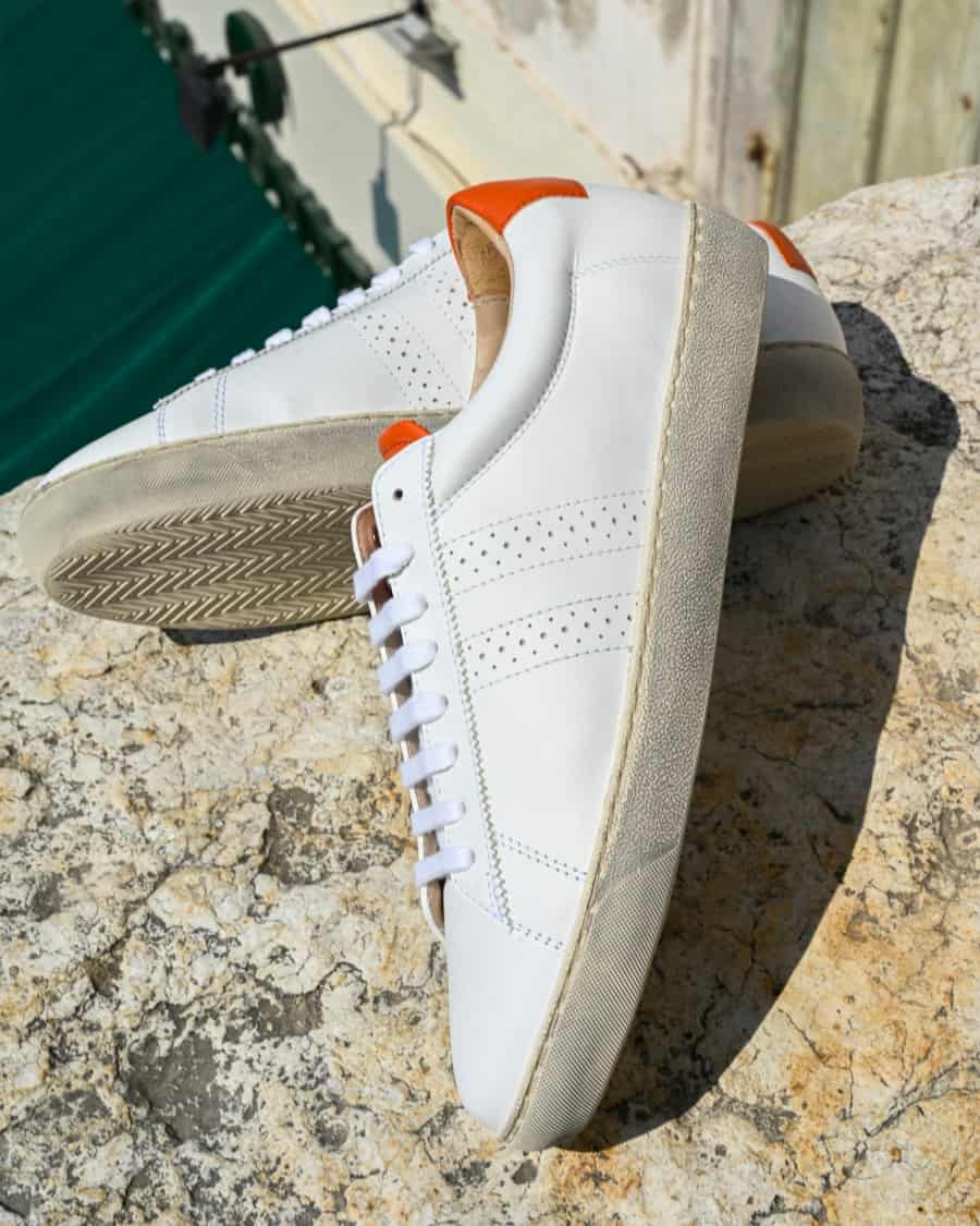 Paid of Zespa leather sneakers on rock