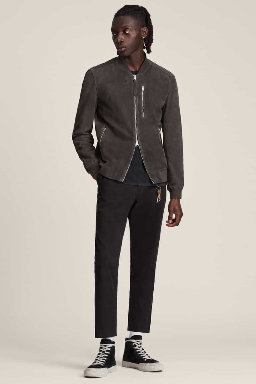 Men's black cropped chinos, black T-shirt, charcoal suede bomber jacket and black canvas high-tops outfit