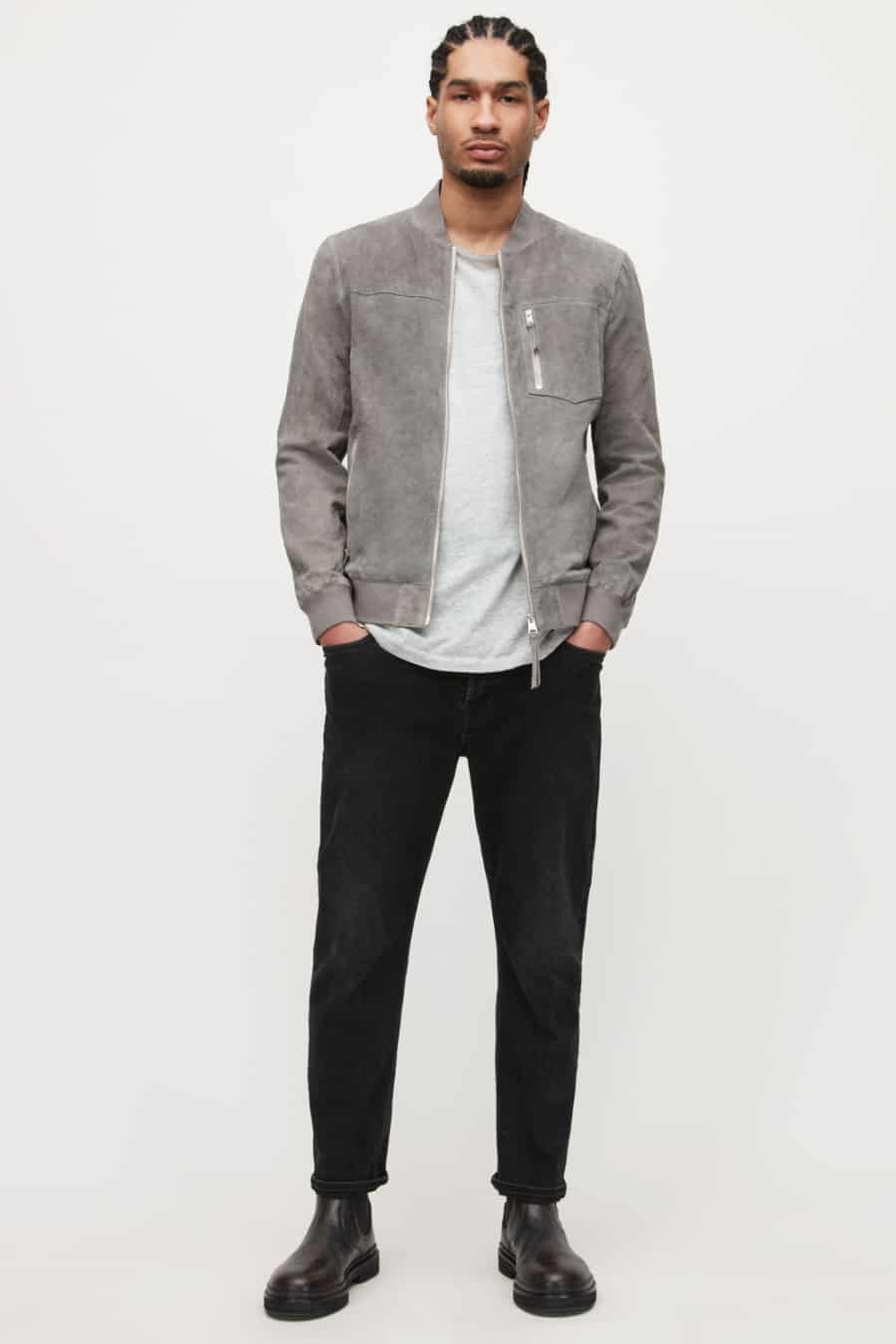 Men's black jeans, light grey T-shirt, grey suede bomber jacket and brown Chelsea boots outfit