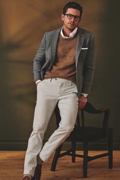 Men's grey chinos, white shirt, brown sweater and grey sports coat outfit