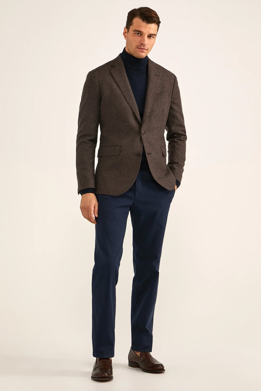 Men's navy cinos, navy turtleneck, brown wool blazer and brown leather penny loafers business casual outfit