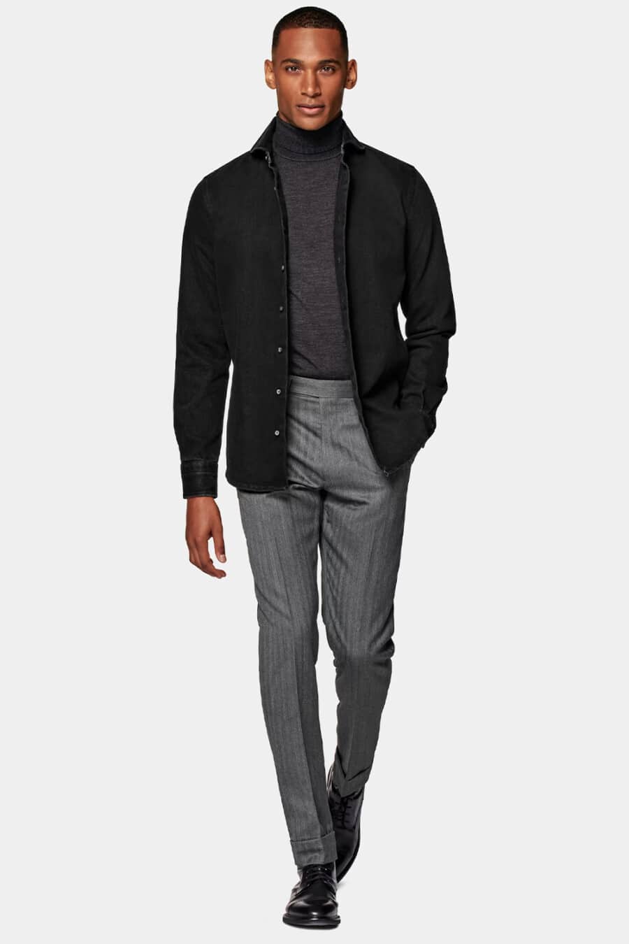 Men's grey flannel trousers, charcoal turtleneck, black overshirt and black leather Derby shoes business casual outfit