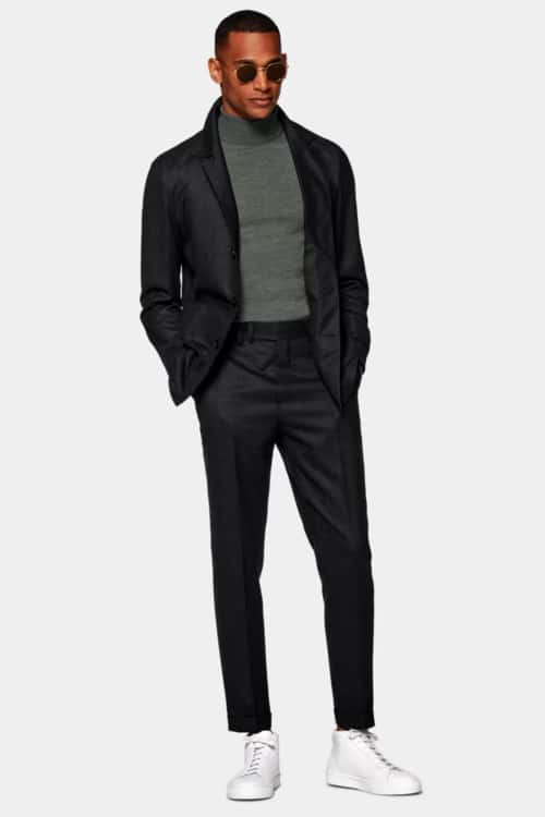 Men's black suit, green roll neck and white sneakers outfit